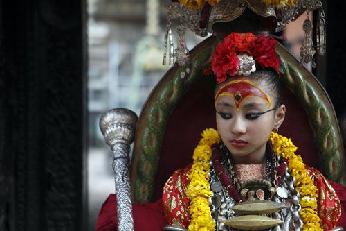 DIVINE GAZE: The Living Goddess Kumari looks on during the Rato Machindranath Nath Jatra in Patan which started on Wednesday. The chariot festival is celebrated in honour of the rain god.