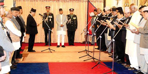 FOLLOW ME: PM Baburam Bhattarai swears in 11 of the 12 newly appointed ministers at the President's office in Shital Niwas on Sunday. UMDF's Rajendra Mahato was unable to join the ceremony.