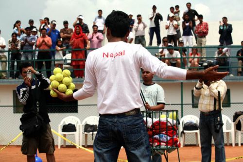 Rohit Timilsina attempts to break the Guinness Book of World Records in 'Holding 21 tennis balls for 14 seconds 34 miliseconds at the All Nepal Lawn Tennis Association, Satdobato on14th June.The record is currently held by Mr. Arunad Deschamps of France, who has the record of holding 19 Lawn Tennis balls for 10 seconds.