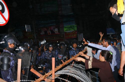 BORDER LINE: Protestors and security personnel stand face to face outside the CA building in Baneshwor on Sunday evening.
