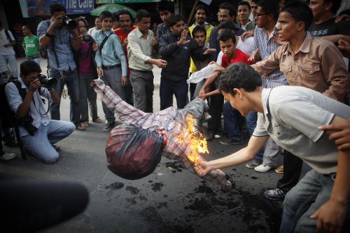 BURN ONE DOWN: Student unions protest in front of Ratna Rajya Campus, Kathmandu, against the government's decision to hold fresh CA elections, demanding immediate resignation of Prime Minister Baburam Bhattarai.
