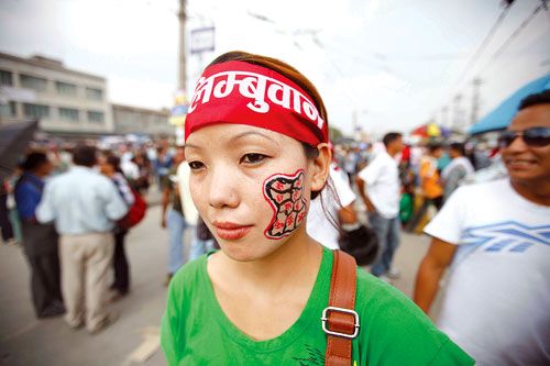 CARTOGRAPHY: A girl from the Limbu community demanding Limbuwan state outside the CA building in Baneshwor on Sunday, with a map of the proposed state painted on her cheek.