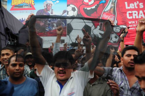 BLACK FAREWELL: Members from opposition parties wave black flags outside the airport as PM Baburam Bhattarai leaves for Rio de Janeiro, Brazil to attend the Rio +20 Summit on Monday.