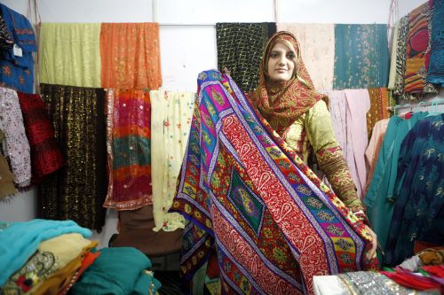 LOVE THY NEIGHBOUR: A Pakistani trader shows off a fabrics at Made in Pakistan, an exhibition of Pakistani products, in Kathmandu on Wednesday.