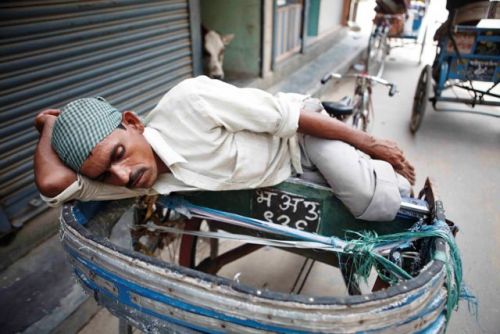 NAP TIME: A rickshaw driver in Nepalgunj takes a nap while waiting for customers last week.