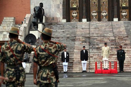 HONOUR GUARD: Instead of the king, the prime minister takes the guard of honour at the former palace.