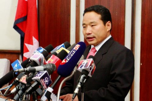 PARTIAL SOLUTION: Finance Minister Barsha Man Pun presents a partial budget at Singha Darbar in Kathmandu on Sunday. The government announced one-third budget of Rs 161.24 billion for the fiscal year 2012/13 through an ordinance. . PIC