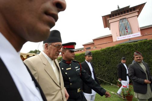 HONOUR GUARD: Instead of the king, the prime minister takes the guard of honour at the former palace.