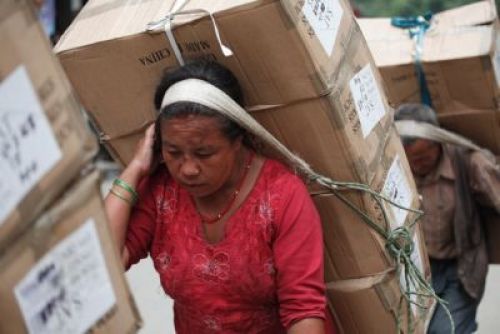 HEAVY LOAD: A labourer transports goods in Kalimati on Wednesday afternoon. PIC