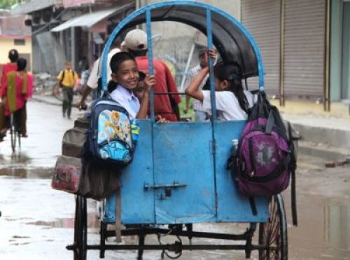 UNSAFE RIDE: Students commute in a rickshaw van in Nepalgunj on Wednesday.  PIC