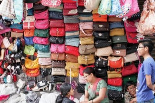 BAGDROBE: A vendors displays her large collection of bags on sale in New Road on Saturday.