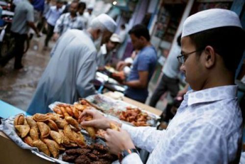 BREAKING FAST: A vendor sells food for Iftar (evening meal) in Bagbazaar on Sunday evening. Muslims break their fast during Ramadan after sunset with dates and light snacks.