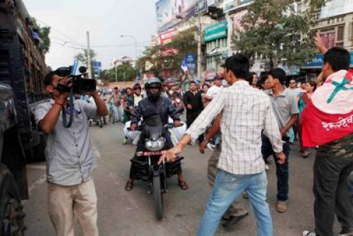 GUILTY CONSCIENCE: Supporters of Khum Bahadur Khadka try to vandalise a motorbike near Maiti Ghar on Tuesday afternoon. NC cadres came out on the streets shortly after the Supreme Court convicted Khadka on corruption charges and sentenced him to one and half year in jail