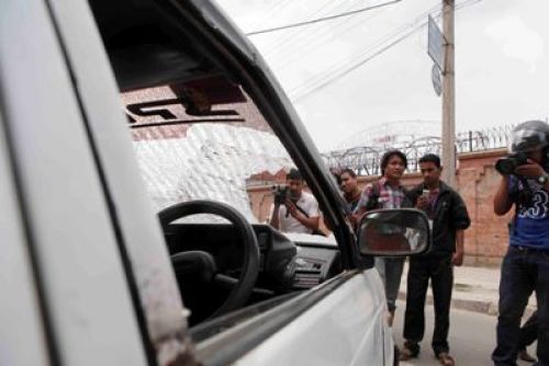 WE LOOT, YOU PAY: Supporters of Khum Bahadur Khadka smashed the windshield of a car near Babar Mahal on Tuesday afternoon in protest after Khadka was sentenced to jail.