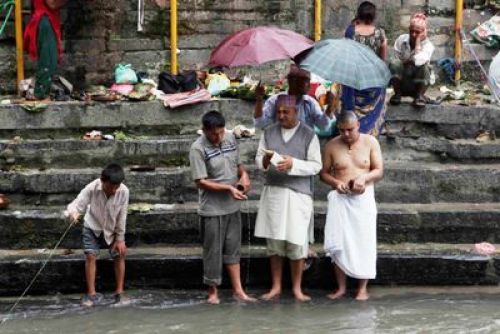 IN THE NAME OF THE FATHER: Hindu devotees perform rituals at Gokarna temple on the banks of the Bagmati on the occasion of Kuse Aunsi on Friday morning.  PIC