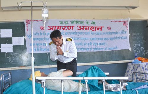 HANGING ON: Captain Bijay Lama greets Dr Govinda KC of Tribhuvan University Teaching Hospital on Saturday. KC who was protesting against the use of political influence in the appointment of officials at the Institute of Medicine ended his fast unto death after six days on Saturday evening.
