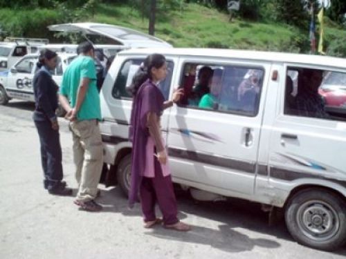 MAKING SURE: Women from Maiti Nepal along eith the local police check vehicles along the Ilam-India border on Saturday in an attempt to curb cross-border trafficking of women. PIC