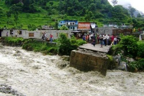 OUT OF CONTROL: After Saturday night's flood in the Lungdi rivulet swept away a wooden motorable bridge, the Maldhunga-Beni road connecting Beni with the national highway has been blocked. PIC