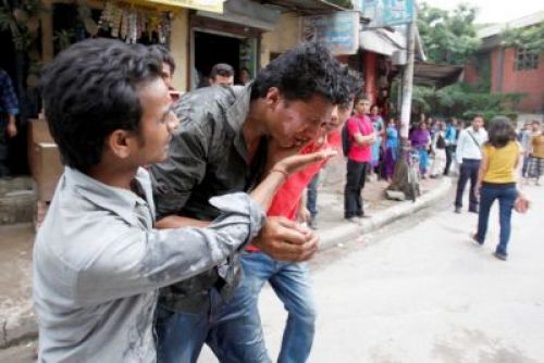 SELF IMMOLATION: A student being taken to hospital after his face accidentally caught fire while burning effigy of Prime Minister Baburam Bhattarai in front of Tri-Chandra Campus in Kathmandu. PIC