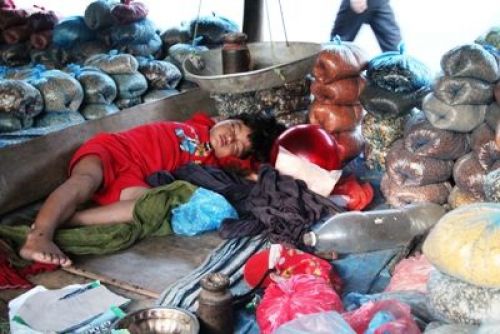 NAP TIME: A child falls asleep while his parents attend to customers at Malekhu bajaar on Sunday evening. PIC