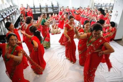 TEEJ FEVER: Female staff of Employees Provident Fund celebrate an early Teej on Monday afternoon at their office in Pulchok. PIC