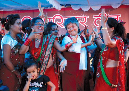 LIFTING SPIRITS: Hisila Yami (centre) joins women at the Army Officers's Club in Sundhara on Saturday to celebrate the upcoming Teej festival.
