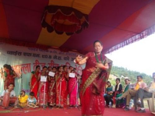 TIME TO PARTY: A member from a mothers' group enjoys herself during a Teej celebraion program on Sunday in Gorkha. PIC