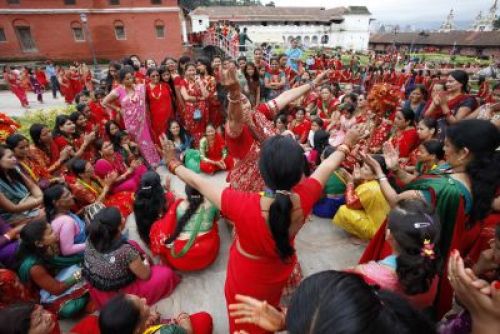 FAST AND DANCE TOGETHER: Women dance during the Tij festival at Pashupatinath, Kathmandu, today. Women fast for their husbands for better health and prosperity. PIC