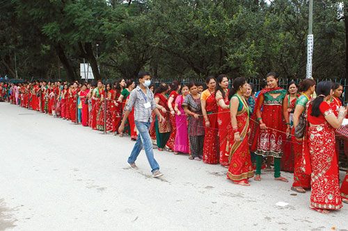 LADIES IN RED: Women line up patiently outside Pashupatinath and await their turn to perform Tij poojas. During this festival, women fast for the good health and prosperity of their husbands.