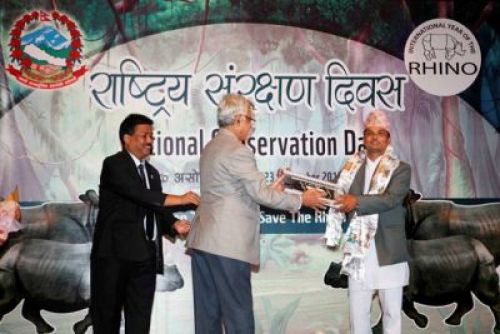 GREEN AWARD: Photojournalist Krishna Mani Baral receives WWF Media in conservation award 2012 during National Conservation Day at City Hall on Sunday.