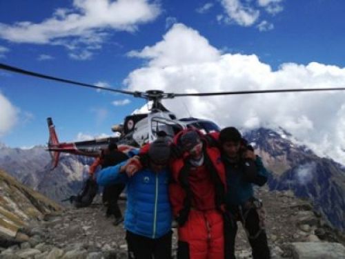 SAVED: A mountaineer is rescued at Manaslu Base Camp after an avalanche swept away camps on Sunday morning.