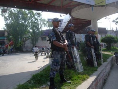 PROTECTING US: Armed Police Force deploy more soldiers during the festivities around the valley. Ten soldiers (six not pictured) watch the overhead bridge at Ratna Park, Kathmandu, on Wednesday.