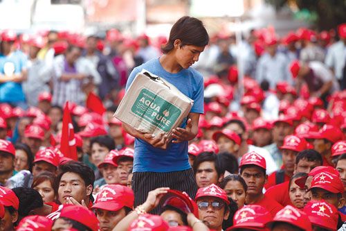 THIRSTY FOR MORE: People listen on as Mohan Baidya explains the CPN-M's plan to announce a new constitution from the streets if its demand for a round table conference is ignored in Basantapur on Wednesday.