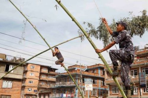 READY TO GO: With a little help from the police, a bamboo swing is finished and ready to be enjoyed during Dasain in Lalitpur, on Monday.