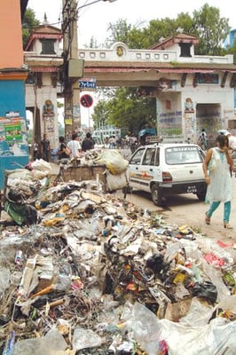 STINK AND THE CITY: It has been three weeks since Kathmandu's garbage stopped being collected because of strikes at both the landfill site in Sisdole and the transfer station in Teku. A Rs 10 million deal was finally struck last week with Sisdole residents for the privilege of hosting the capital's trash. But then Teku residents went on warpath, demanding the dump be shifted. The city produces 350 tons of garbage daily, but 75 percent of it is biodegradable so it could easily be turned into valuable fertiliser if it was sorted. But there is good news. Dinesh Thapaliya at Kathmandu municipality says garbage collection will resume on Friday.