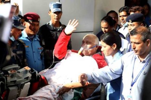 GET WELL SOON: Leader of CPN-UML, KP OLI, waves to his supporters outside Norvic Hospital in Thapathali before being airlifted to New Delhi at Narvic Hospital on Sunday afternoon.