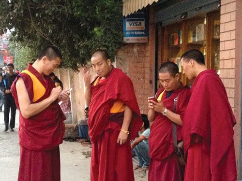 CALL ME MAYBE: Buddhist monks with matching red phones seen in Thamel.
