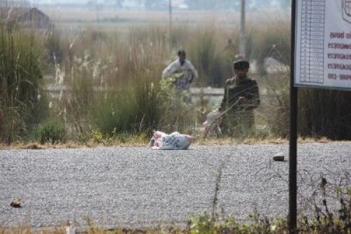 KEEP THE DISTANCE: Police dispose a bomb in a safety place after it was found inside a bus coming from Narayanghat, in Jhapa, Monday morning.