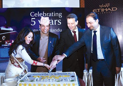 HIGH FIVE (l-r): Pawana Shrestha (country manager), Suresh Acharya (joint secretary at the Ministry of Tourism), Adam Phillips (vice president, Asia Pacific North and Indian subcontinent), and Amer Khan (general manager for Pakistan, Bangladesh, and Nepal) celebrate Etihad Airways' five years of service in Nepal at Hotel Hyatt, last Thursday.
