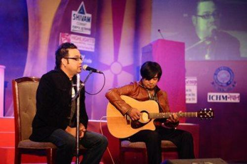 HIGH TUNES: Nepali singer Sworup Raj Acharya(L) performs during Bindabasini Music Award 2069 at Army Officer Club on Sunday evening.