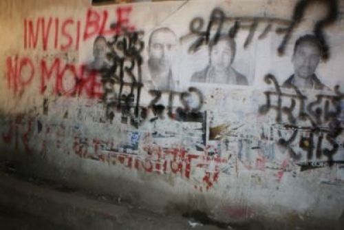 INVISIBLE NO MORE: Rights activists and families of disappeared war victims pasted photos and painted graffiti on the walls in Ratnapark on Monday to draw the government's attention.