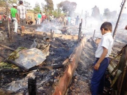 ALL GONE: A boy inspects the remains of a house that was burnt down during the fire on tuesday in one of the refugee camps in Damak, Jhapa.