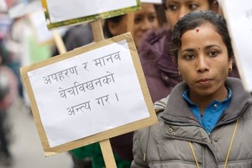 RIGHT THERE: A woman holds a sign with 'stop human trafficking' written on, during International Human Rights Day 2012 rally at Bhrikuti Mandap, Kathmandu on Monday.