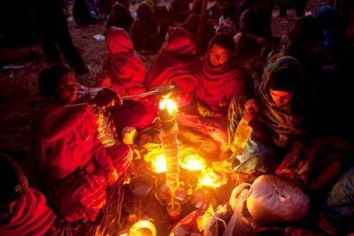 CANDLE IN THE WIND: women light oil lamps during Bala Chaturdasi, a celebration in the memory of departed ones at Pashupati Temple on Tuesday evening.