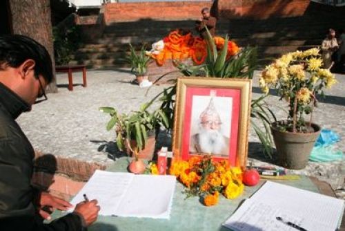 RIP: A man signs a memorial book and pays respect to poet Purna Prakash Yatri at Nepal Academy in Kamaladi, on Thursday. The literary figure died at 79 years old on Thursday morning.
