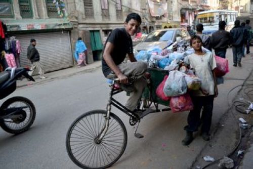 WASTED CHILDHOOD: Sagar Shrestha (r) from Ramechhap and his friend Bishal Khadka (l) during a garbage collection run on Sunday. Sagar ran away from home because his father was physically abusive towards his mother.