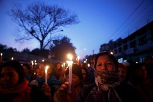 CANDLE IN THE WIND: A group of women participate during a candle light rally for women's rights at Exhibition Road on Thursday evening.