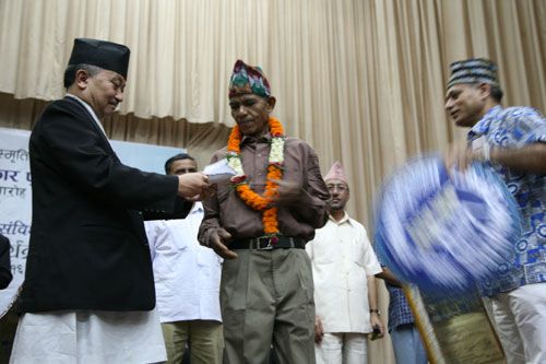 RECOGNITION: Assembly Speaker, Subhas Nembang, presents the 2064 Prakash Human Rights Award to Free Kamaiya Movement leader, Dukhuwa Tharu, at a function organised by INSEC on Thursday. The award is to commemorate human rights campaigner Prakash Kafle, who died in a plane crash on 31 July, 1992.