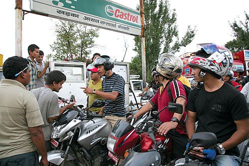 FUELLING ANGER: Tired of waiting in queue for eight hours at the Bansbari petrol pump, a motorcyclist heckles an attendant to fill up his tank. Usually motorcyclists are only given 5 litres.