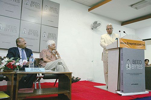 AUTHOR BEED: Prabhakar Rana speaks at the launch of the book Beed Bytes by Nepali Times columist Sujeev Shakya (left) on Wednesday. The book is a collection of the Economic Sense column from the past eight years.